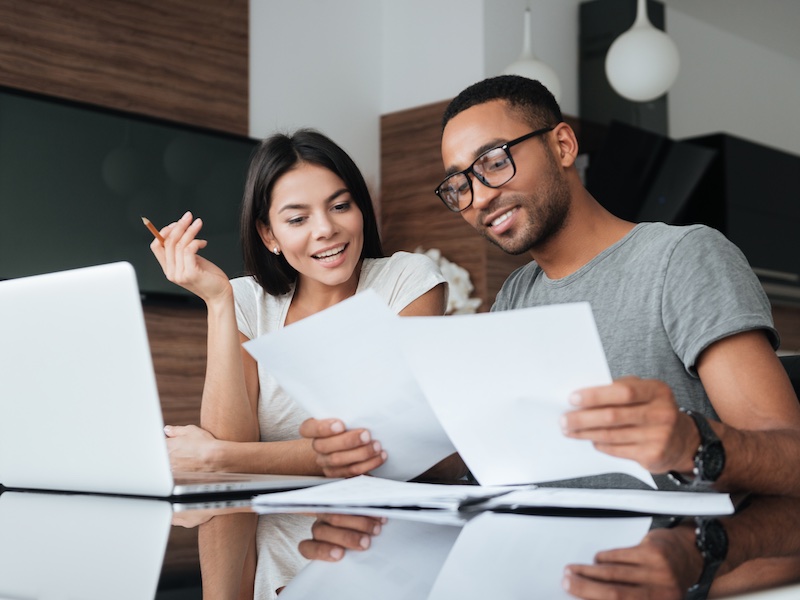 Group of people looking at laptop